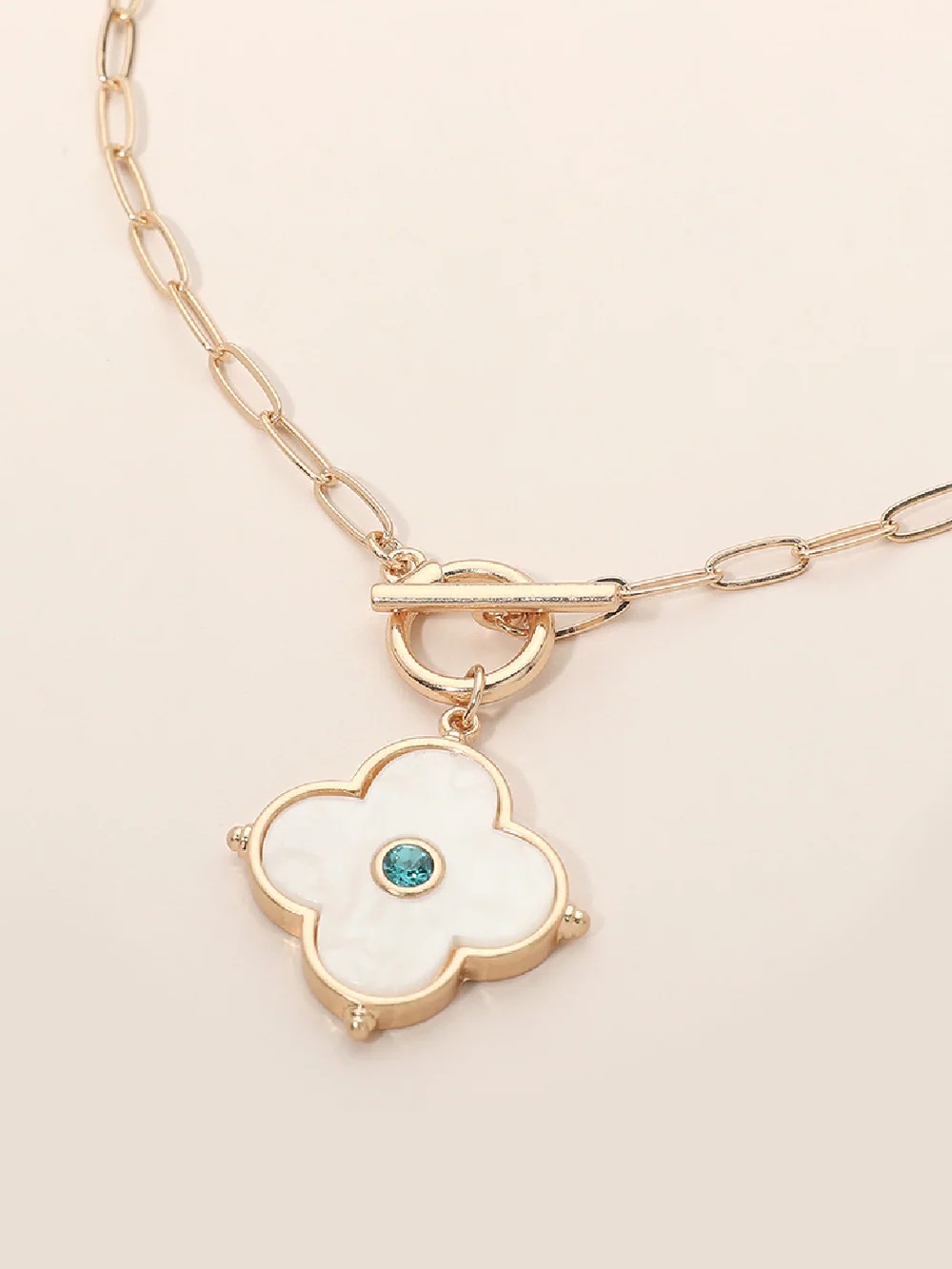 Gold Clover Pendant Necklace with White Inlay and Blue Stone